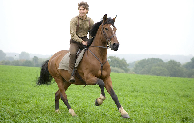 "WAR HORSE"..DM-AC-25226..Albert Narracott (Jeremy Irvine) joyfully rides atop his beloved horse, Joey in DreamWorks Pictures' "War Horse", director Steven Spielberg's epic adventure and an unforgettable odyssey through courage, friendship, discovery and wonder...Ph: Andrew Cooper, SMPSP..©DreamWorks II Distribution Co., LLC. ÊAll Rights Reserved.