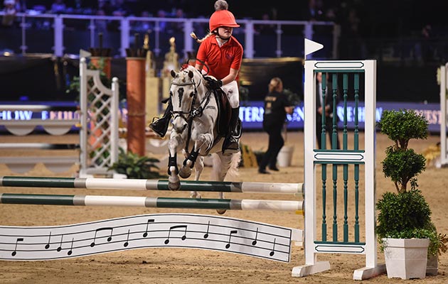 Ellie Burrell Squibb and William Funnell during of Class 13 (Mini Major) at the Equestrian.com Liverpool International Horse Show at Echo Arena, Liverpool, UK; on 1st January December 2016