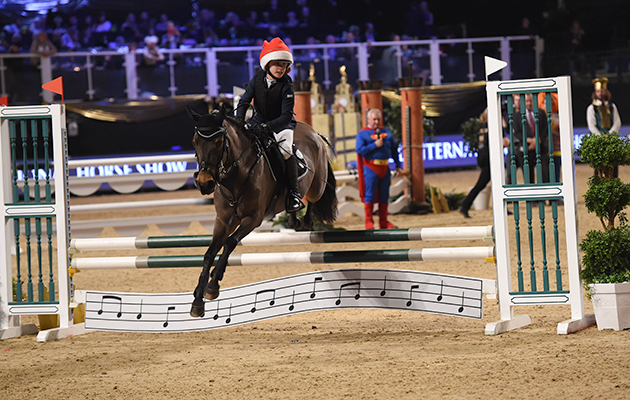 Noora Von Bulow and David Simpson during of Class 13 (Mini Major) at the Equestrian.com Liverpool International Horse Show at Echo Arena, Liverpool, UK; on 1st January December 2016