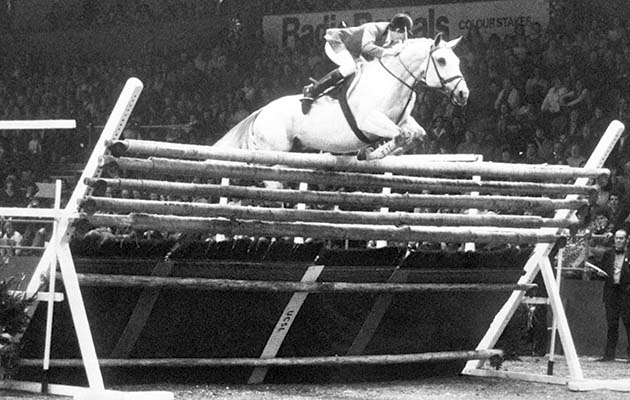 Nick Skelton on his horse 'Everest Lastic' clearing the fence to break the record at 7 ft 7in 5/16th (2.32m).