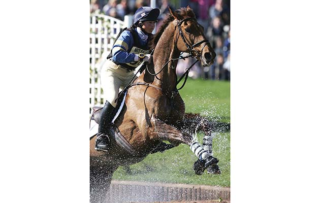 BADMINTON, ENGLAND - MAY 7: Jeanette Brakewell of Great Britain on Over To You clears the water jump in the Cross Country Test during the Mitsubishi Motors Badminton Horse Trials at Badminton on May 7, 2005 in Badminton, England. (Photo by Christopher Lee/Getty Images)