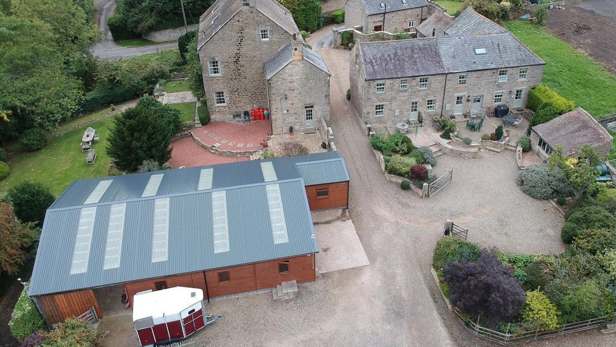 A house with additional cottages, allweather arena and stabling for a