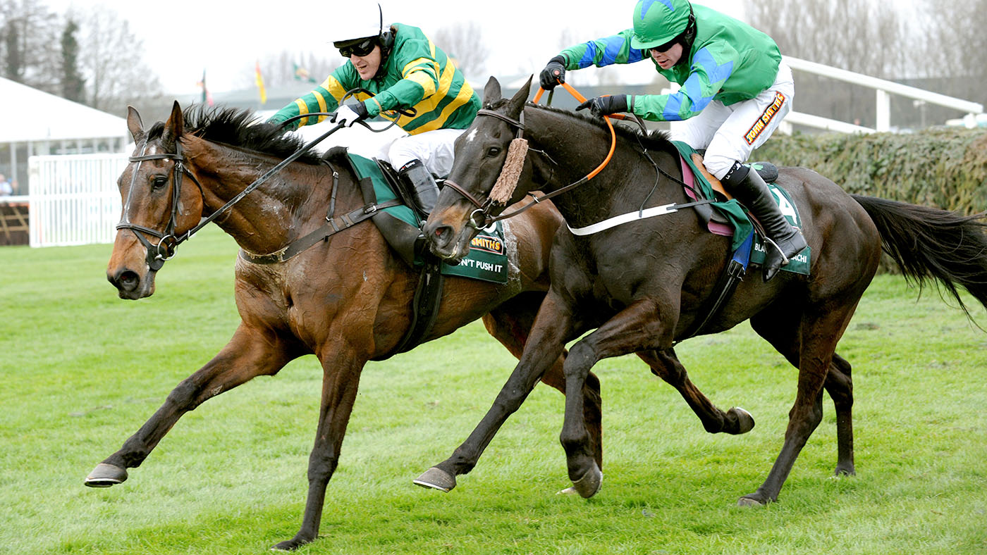 Don't Push It ridden by Tony McCoy (left) beats Black Apalachi ridden by Denis O'Regan to win the John Smith's Grand National at Aintree Racecourse, Liverpool.