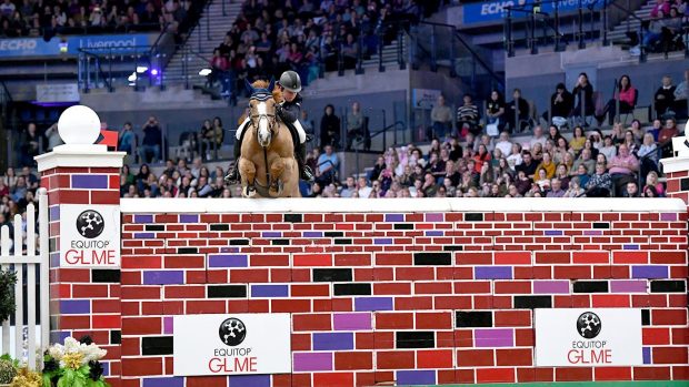 Showjumper Matt Sampson pictured in the puissance at the Liverpool International Horse Show