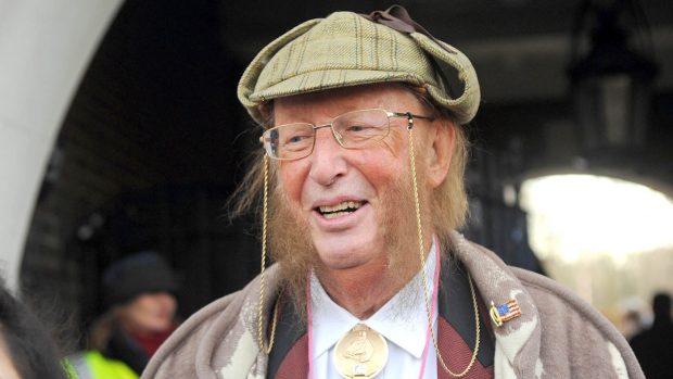ECGDXE London, UK. 14th December, 2014. John McCririck teaches tic tac before pantomime horse race. Greenwich Village annual sci-fi parade and pantomime horse race. Credit: JOHNNY ARMSTEAD/Alamy Live News