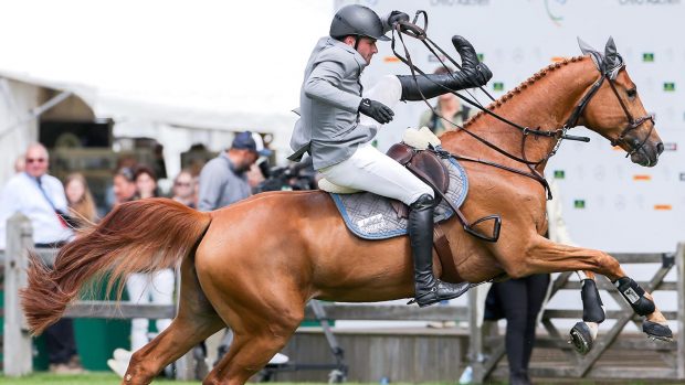 19 July 2019, North Rhine-Westphalia, Aachen: CHIO, equestrian sport, jumping, North Rhine-Westphalia Prize: The rider Philipp Weishaupt from Germany falls from his horse Che Fantastica. Photo: Rolf Vennenbernd/dpa
