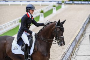 Lottie Fry leaves the Rotterdam arena on Dark Legend after their grand prix test at the European Dressage Championships