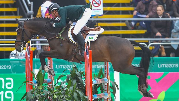 LIMA, PERU - AUGUST 04: Marcelo Tosi of Brazil rides Starbucks during Equestrian Eventing Individual - Jumping Final at Army Equestrian School on Day 9 of Lima 2019 Pan American Games on August 4, 2019 in Lima, Peru. (Photo by Daniel Apuy/Getty Images for FEI)