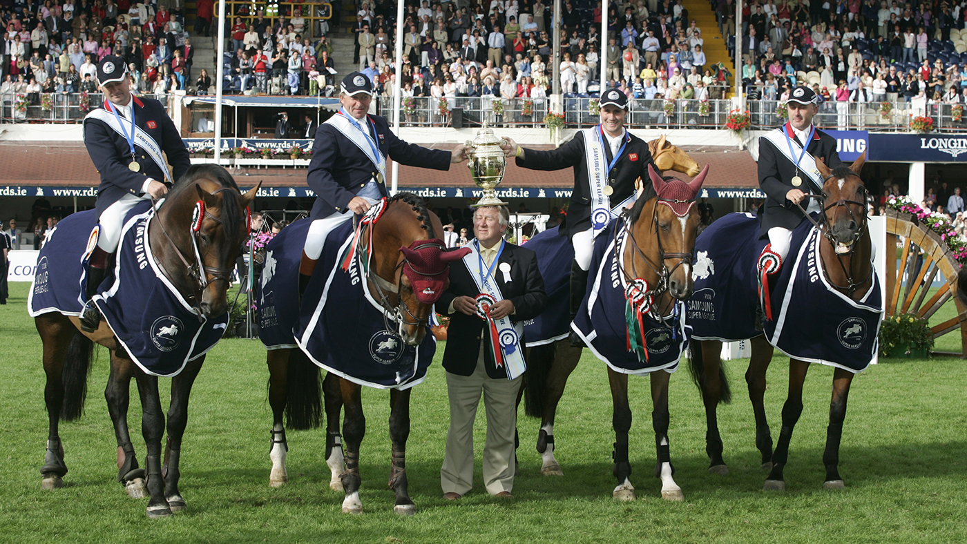 08.08.08 . The Samsung Super League Show Jumping Competition winners , the Great Britain team (not in order) Peter Charles and Murka's Rupert R , Tim Gredley and Omelli , Robert Smith and Vangelis S and Nick Skelton and Arko III . David Broome holds to winning trophy cup .