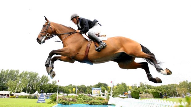SAYERS COMMON, ENGLAND - JULY 26: William Funnell of Great Britain ridding Cortaflex Mondriaan going over the water jump during the Longines King George V Gold Cup at the Longines International Horse Show at Hickstead on July 26, 2009 in Sayers Common, England. (Photo by Phil Cole/Getty Images)