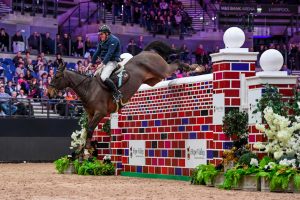 Harry Whall jumps 2.21m at Liverpool International Horse Show.