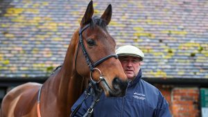 National Hunt trainer Paul Nicholls poses alongside Cyrname during a stable visit at Manor Farm Stables ahead of the Betfair Ascot Chase meeting on February 10, 2020 in Ditcheat, Somerset. (Photo by Michael Steele/Getty Images)