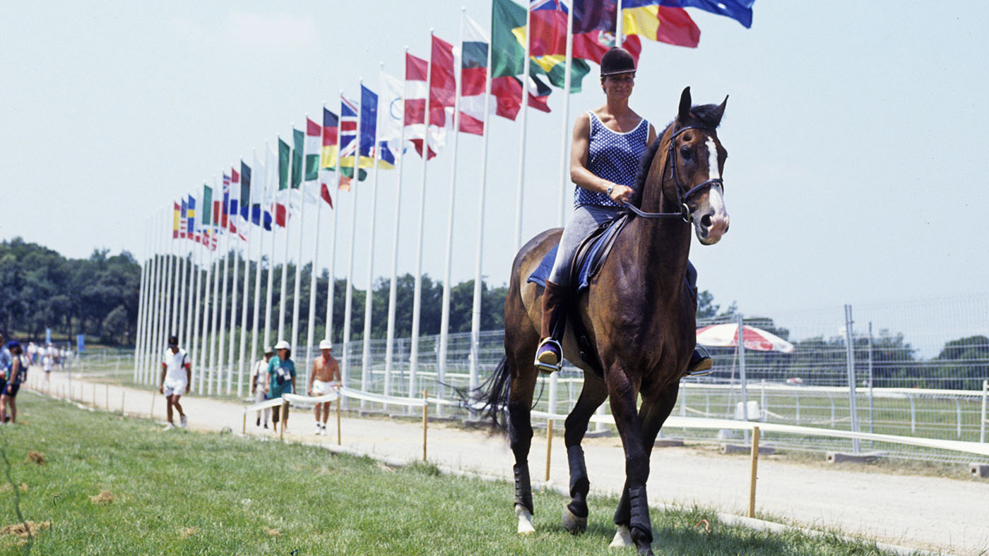 Mary Thomson (King) at the Barcelona 1992 Olympics with King WIlliam , excersising with international flags in background