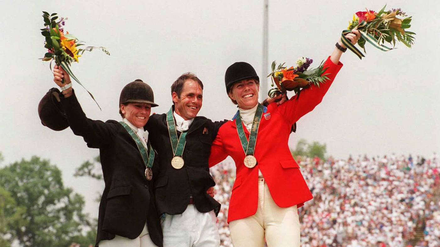 ATLANTA, GA - JULY 26: (L-R) Silver medalist Sally Clark of New Zealand, compatriot, gold medalist Blyth Tait, and bronze medalist Kerry Millikin of the US pose on the podium after receiving their medals for the Olympic Individual Jumping event 26 July in Atlanta. (FOR EDITORIAL USE ONLY) (Photo credit should read MICHAEL JUNG/AFP via Getty Images)