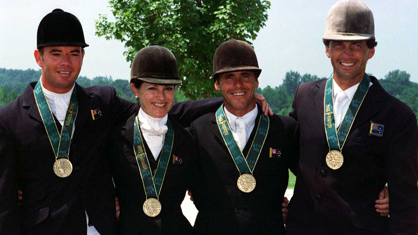 ATLANTA, UNITED STATES - JULY 22: New Zealand's bronze medal winners from left Vaughn Jefferis,Vicky Latta,Blyth Tait and Andrew Nicholson display their medals won for the team three day event at the Georgia International Horse Park. (Photo by Ross Land/Getty Images)