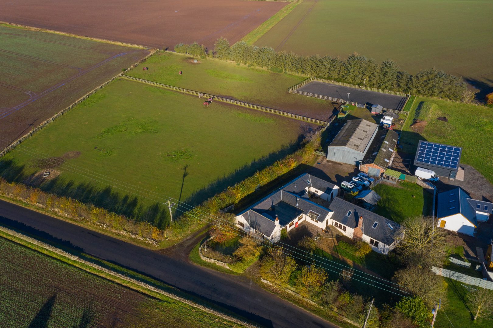 A sixbedroom country property with floodlit arena, paddocks and indoor