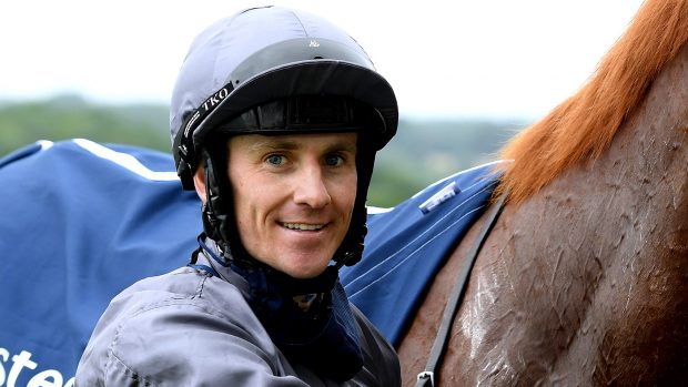 Jockey Emmet McNamara celebrates with Serpentine after winning the Investec Derby at Epsom Racecourse.