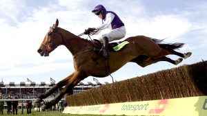 Jockey Barry Geraghty clears the last on Kicking King to go on and win the totesport Cheltenham Gold Cup Steeplechase.