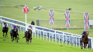 Epsom Derby runners Serpentine ridden by jockey Emmet McNamara (right) wins the Investec Derby at Epsom Racecourse.