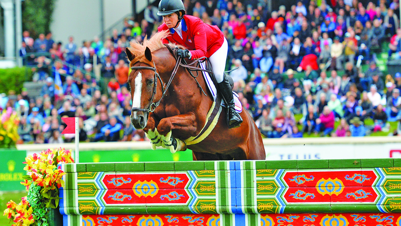 Beezie Madden of USA riding Darry Lou during the CP International at the Spruce Meadows Masters 2019. 