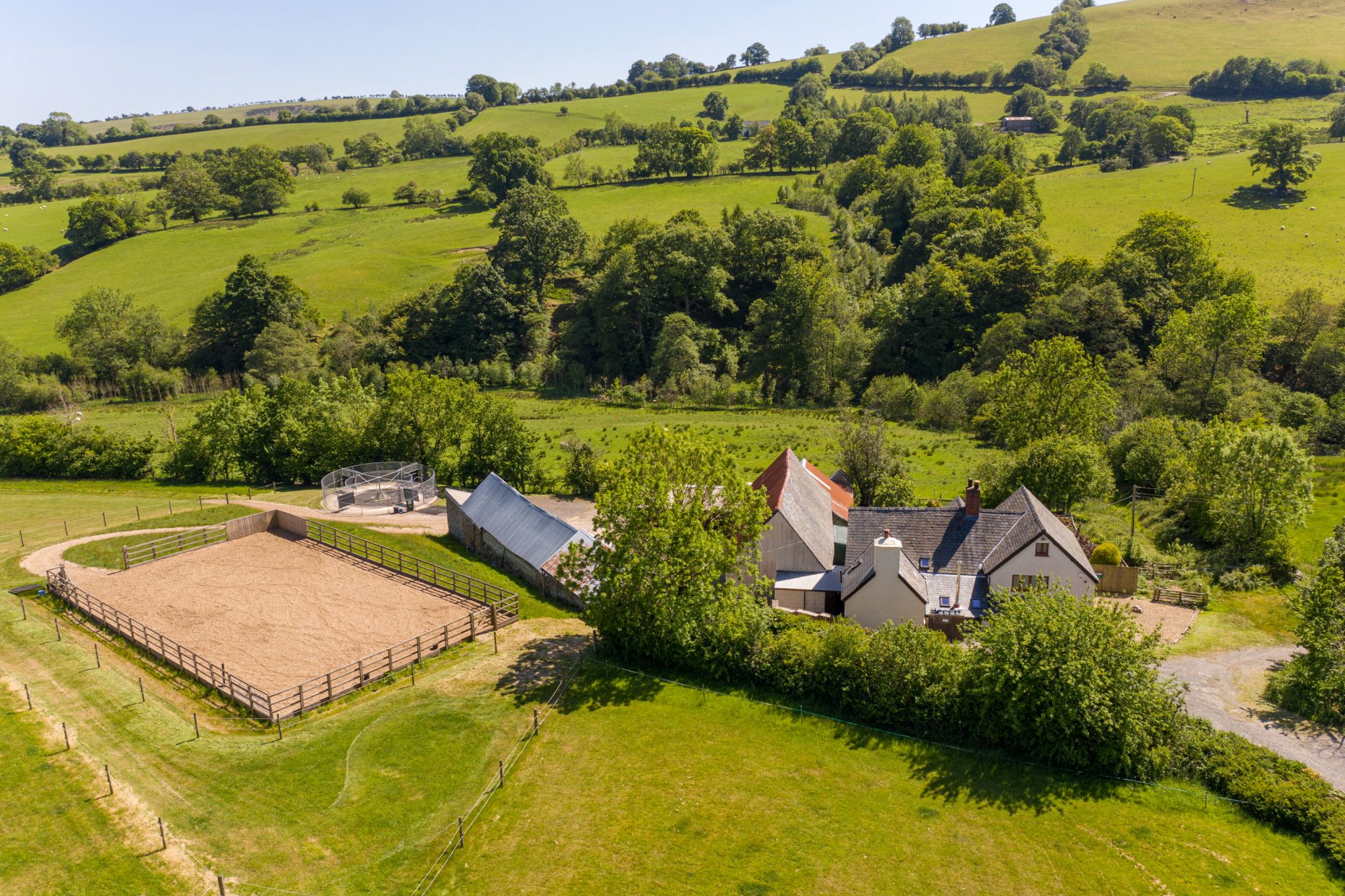 A beautiful location, stables, farmhouse and outdoor school with the