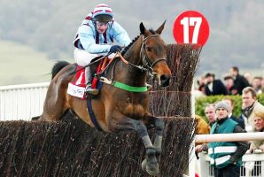 Best Mate jumps the last with Jim Culloty up on their way to win the CheltenhamGold Cup, 14 March 2002, at the Cheltenham Festival. It was a first Gold Cup triumph for jockey Jim Culloty, trainer Henrietta Knight and owner Jim Lewis. The three-day meeting at Cheltenham, South-West England, is the pinnacle of English horse racing’s jumping season. AFP PHOTO GERRY PENNY/gp (Photo by GERRY PENNY / AFP) (Photo by GERRY PENNY/AFP via Getty Images)