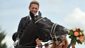 A file picture made available on 18 August 2015 of dressage horse Totilas belonging to Dutchman Edward Gal biting a bouquet presented by businesswoman Marina Meggle, at the victory ceremony of the Grand Prix Special at the CHIO Aachen 2010 eque |