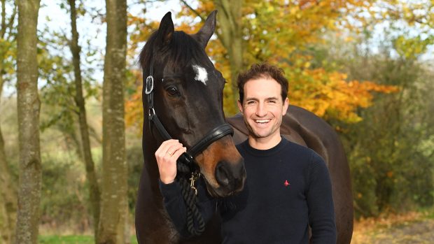 Sonnar Murray-Brown with his top horse Erlentanz TSF at his yard in the village of Bishop Norton near Tewkesbury in Gloucestershire in the UK on 13th November 2020
