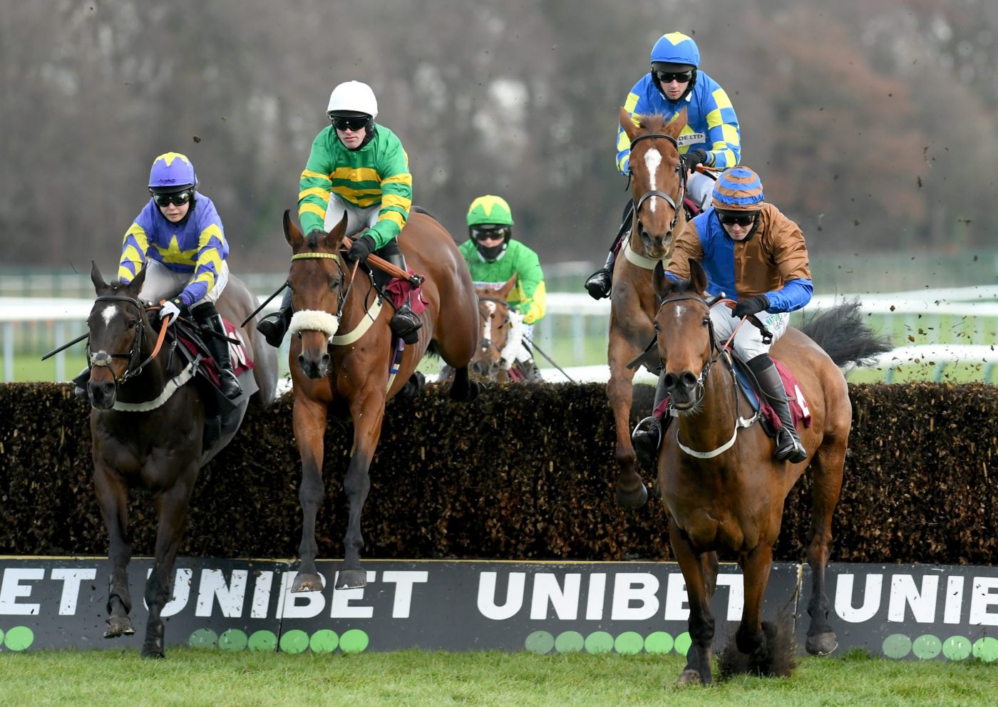 Haydock Unibet 3 Uniboosts A Day Handicap Chase Protek Des Flos and Richie McLernon (2 from left) on their way to winning 323-1-21 pic Bill Selwyn