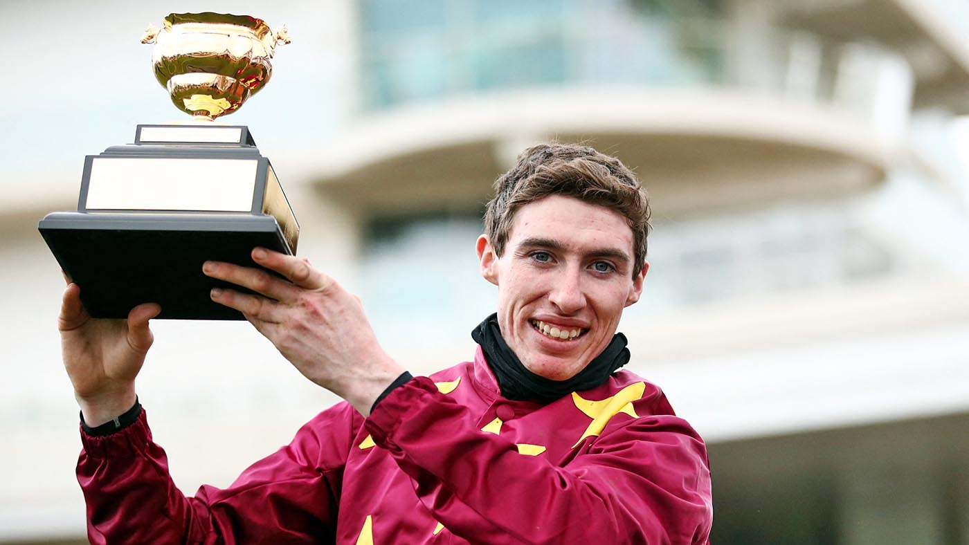 Jockey Jack Kennedy poses with the Gold Cup trophy after riding on Minella Indo to to win during the WellChild Cheltenham Gold Cup 2021.