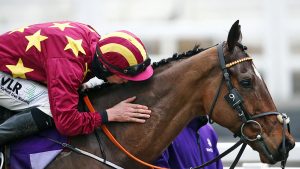 Jockey Jack Kennedy on Minella Indo celebrates winning the Gold Cup during the 2021 Cheltenham Festival