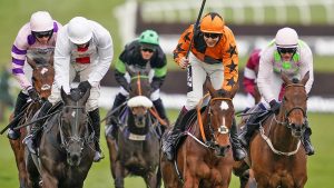 Put The Kettle On CHELTENHAM, ENGLAND - MARCH 17: Aidan Coleman riding Put The Kettle On (orange) clear the last to win The Betway Queen Mother Champion Chase at Cheltenham Racecourse on March 17, 2021 in Cheltenham, England. Sporting venues around the UK remain under strict restrictions due to the Coronavirus Pandemic as Government social distancing laws prohibit spectators inside venues resulting in events being held behind closed doors. (Photo by Alan Crowhurst/Getty Images)