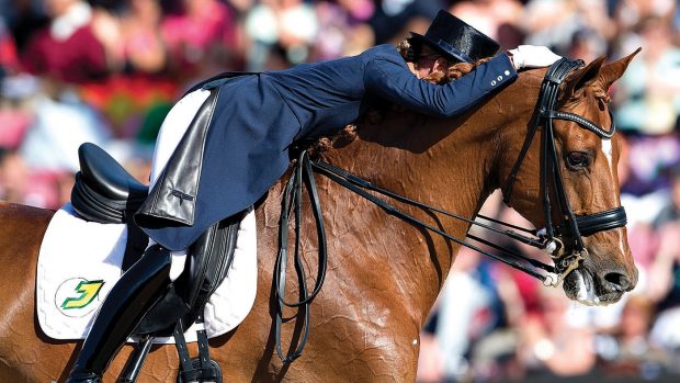 Dutch rider Adelinde Cornelissen on her horse Parzival reacts after competing in the FEI Dressage European Championship Finals in Herning, Denmark, on August 25, 2013.