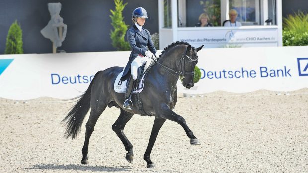 Lottie Fry riding dressage stallion Glamourdale at Aachen