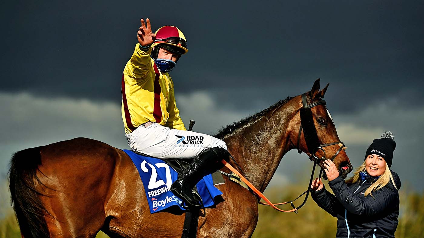 Meath , Ireland - 5 April 2021; Ricky Doyle celebrates on Freewheelin Dylan with stablehand Molly O'Connor afrer winning the BoyleSports Irish Grand National Steeplechase during day three of the Fairyhouse Easter Festival at the Fairyhouse Racecourse in Ratoath, Meath. (Photo By Harry Murphy/Sportsfile via Getty Images)