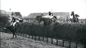 E10T8M Mar. 03, 1974 - Red Rum Wins His Second Successive Grand National At Aintree Today: Red Rum, ridden by jockey Brian Fletcher, today won the Grand National for the second successive year running. He become the first horse complete the double in 38 years. Phot Shows Red Rum, ridden by Fletcher clears Bachers Brook for the second time round, followed by Charles Dickens, ridden by A. Turnell (No. 30) who wa third and L'escargot, ridden by T. Carberry (extreme right) who finished second.