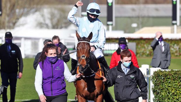 Jockey Rachael Blackmore celebrates after winning the Unibet Champion Hurdle Challenge Trophy with Honeysuckle during day one of the Cheltenham Festival at Cheltenham Racecourse. Picture date: Tuesday March 16, 2021.