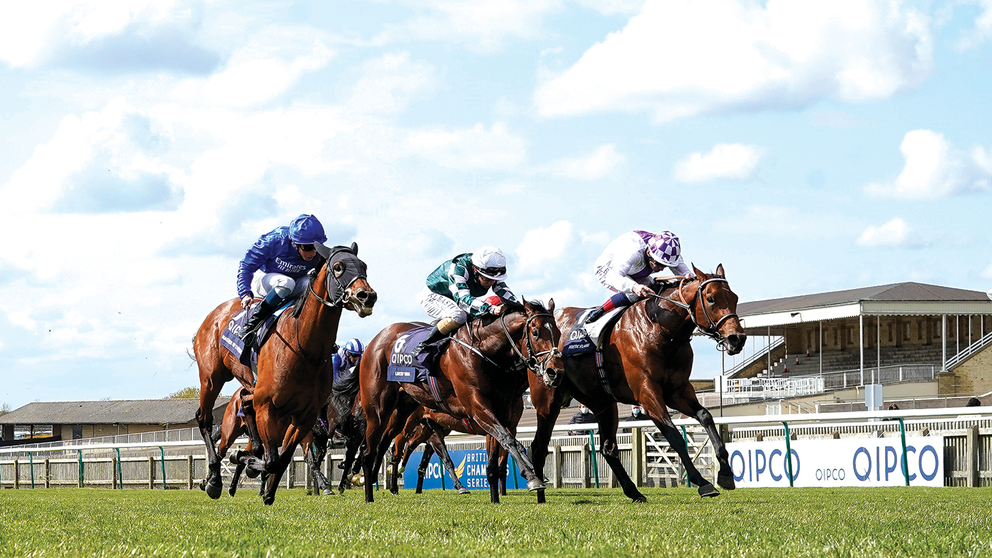 NEWMARKET, ENGLAND - MAY 01: Kevin Manning riding Poetic Flare (R, white) win The Qipco 2000 Guineas Stakes at Newmarket Racecourse on May 01, 2021 in Newmarket, England. Only owners are allowed to attend the meeting but the public must wait until further restrictions are lifted. (Photo by Alan Crowhurst/Getty Images)