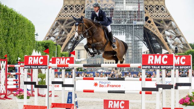 Ben Maher pictured in jumping Ginger Blue in front of the Eiffel Tower on his way to winning the Longines Global Champions Tour of Paris