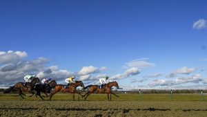 Adam Kirby riding Unforgiving Minute to win at Lingfield