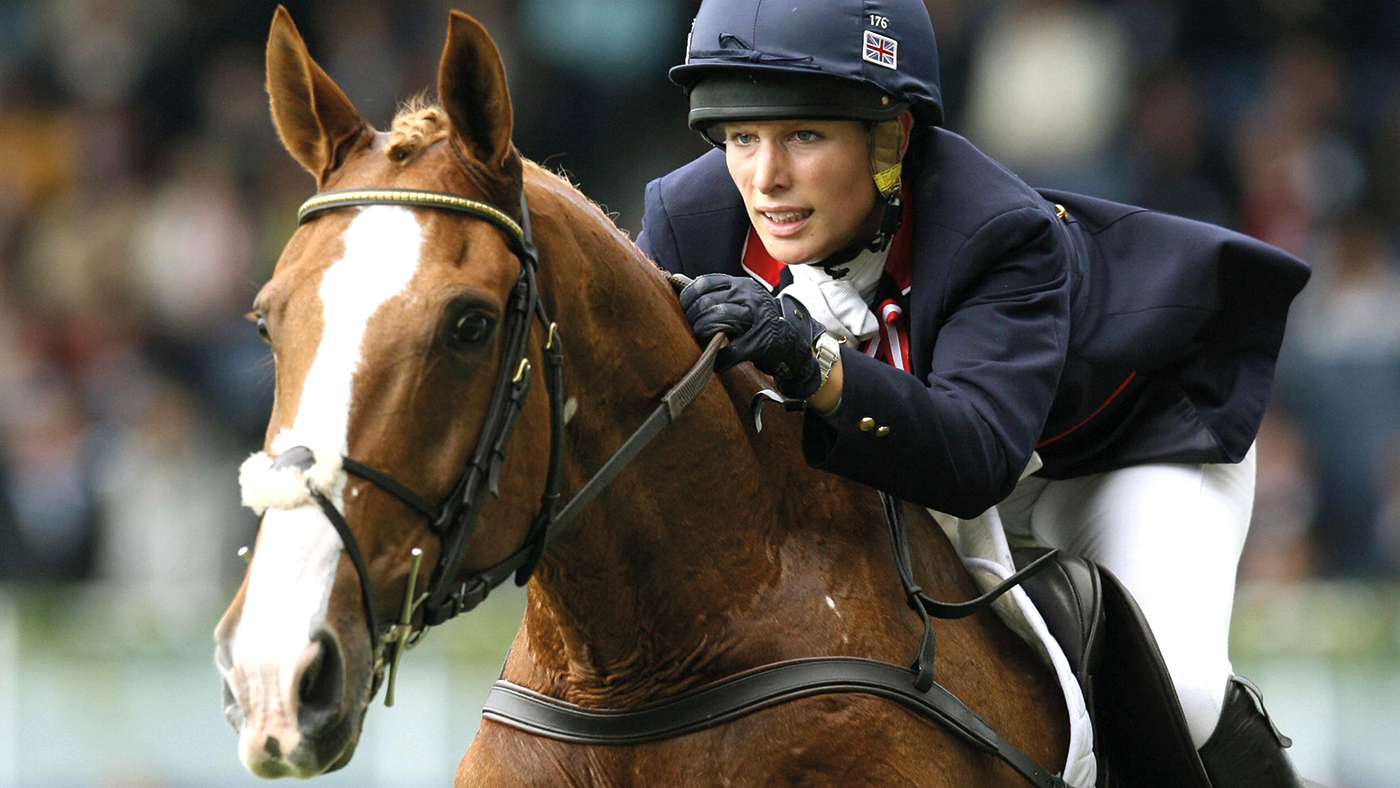 Aachen, GERMANY:  (FILES) British rider Zara Phillips on "Toy Town" jumps the Eventing individual competition of the World Equestrian Games in Aachen, in Germany, 27 August 2006. Phillips won the BBC Sports Personality of the Year award on Sunday 10 December 2006, to emulate her mother, the Princess Royal.  The 25-year-old, whose father Mark Phillips was an Olympic gold medallist in the same sport, finished ahead of runner-up Darren Clarke who was a Ryder Cup hero for Europe against America only a few weeks after the death of his wife Heather through cancer.  Phillips won the individual gold on Toytown in the three-day eventing competition at the World Equestrian Games in Aachen in Germany. She produced a near faultless performance over the three days of dressage, cross country and show jumping.  AFP PHOTO DDP/JOCHEN LUEBKE **** GERMANY OUT ****  (Photo credit should read JOCHEN LUEBKE/DDP/AFP via Getty Images)