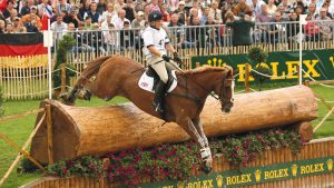 2E8DTFW Britain's Zara Phillips on Toytown jumps the water jumps during the cross country portion of the Eventing competition at the World Equestrian Games in Aachen August 26, 2006. REUTERS/Caren Firouz (GERMANY)