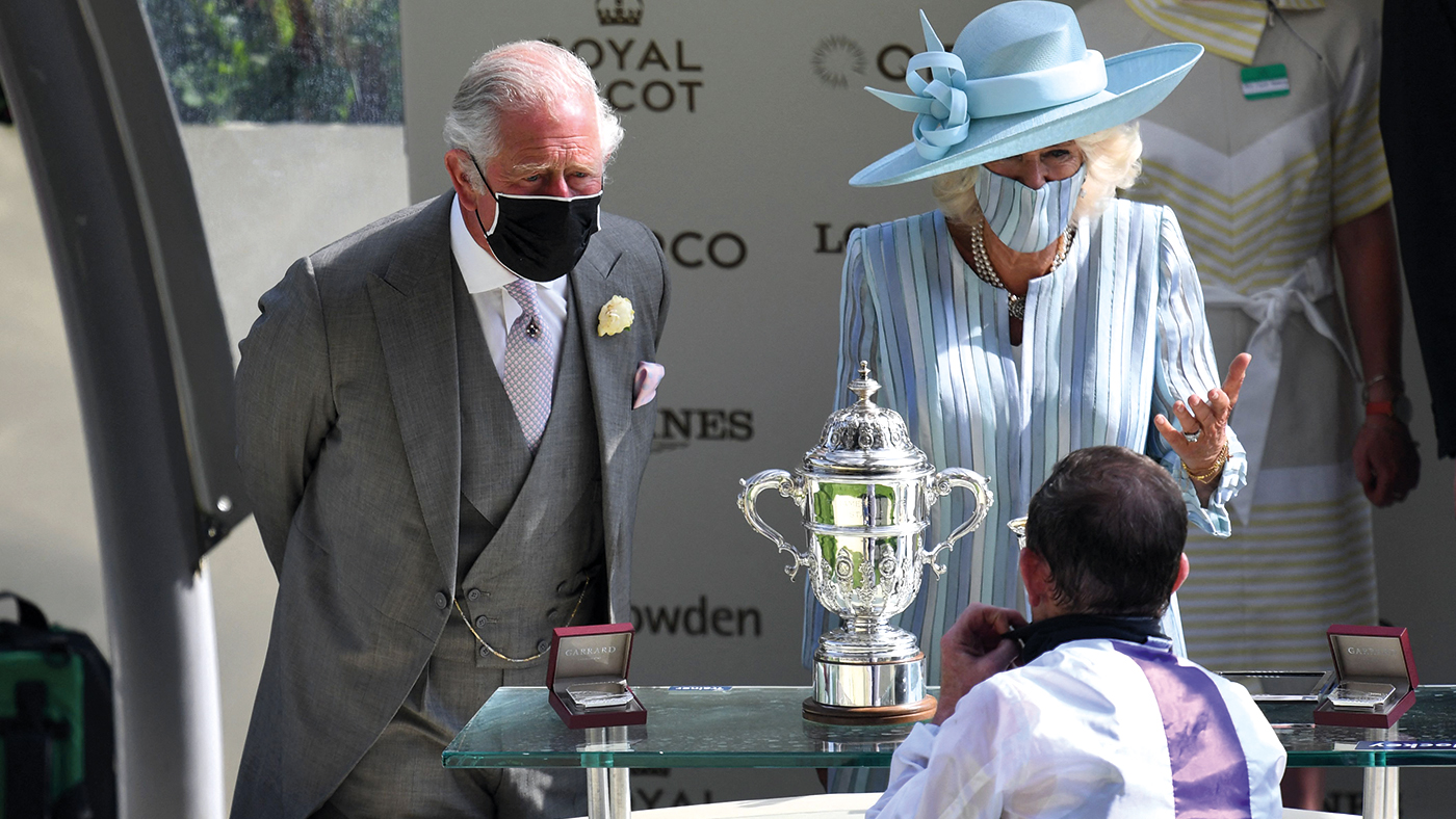 Britain's Prince Charles, Prince of Wales (L) and Britain's Camilla, Duchess of Cornwall speak to jockey Kevin Manning after he won the St James's Palace Stakes on Poetic Flare on the first day of the Royal Ascot horse racing meet, in Ascot, west of London on June 15, 2021. - Royal Ascot is preparing to open its doors to 12,000 racing fans a day but the coronavirus will still take a significant financial toll on the event. (Photo by DANIEL LEAL-OLIVAS / AFP) (Photo by DANIEL LEAL-OLIVAS/AFP via Getty Images)