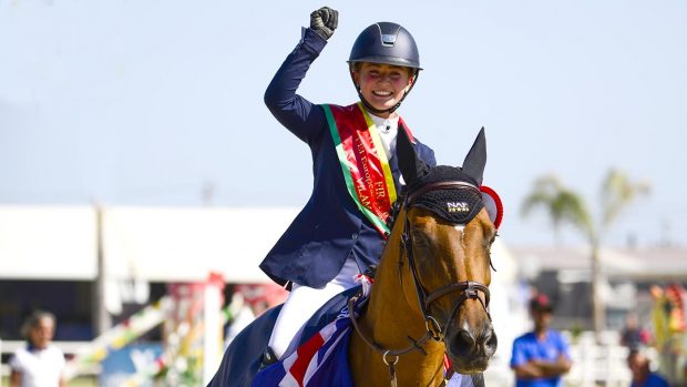Ava Vernon celebrates winning gold at the FEI European Jumping Championships CH/J/YR