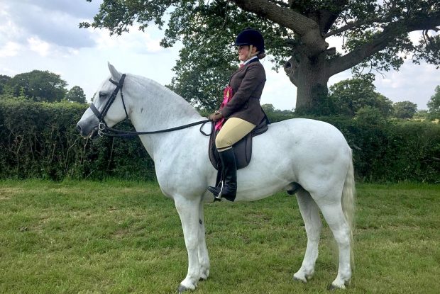 Issy Hind overcomes a fractured spine to qualify her Connemara Sydserff Gismo for two classes at the Royal International