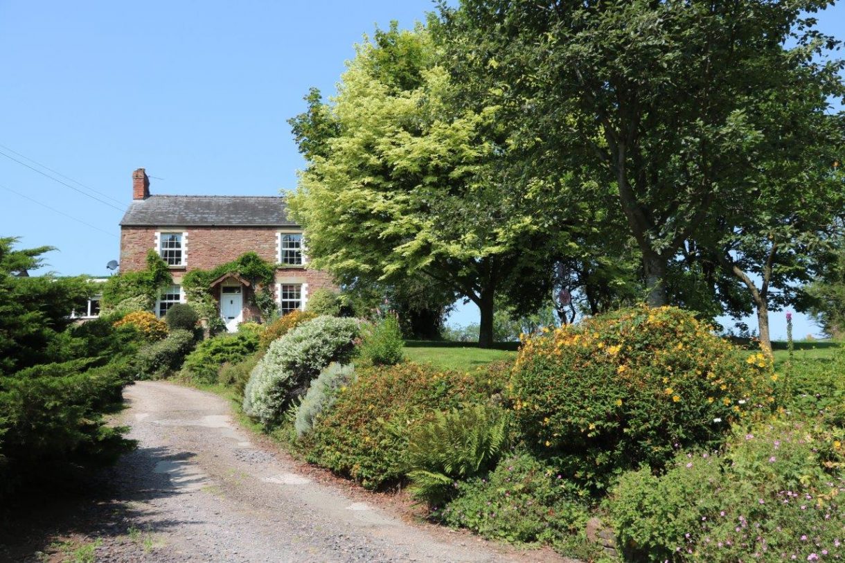 The prettiest sandstone cottage with new outdoor arena, two stables and