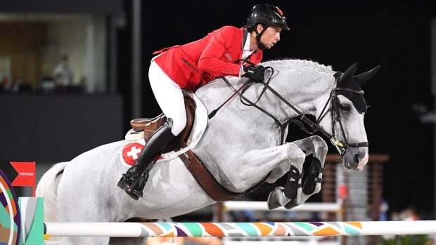 Martin Fuchs pictured riding Clooney 51 at the Tokyo Olympics