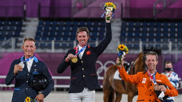 Ben Maher, Peder Fredricson and Maikel van der Vleuten celebrate on the podium after the Olympic showjumping individual final