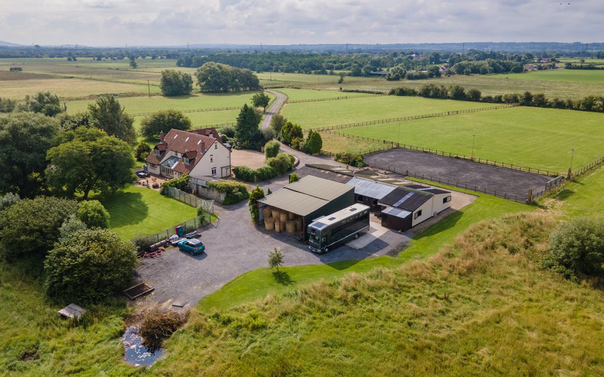Make a home for life out of this farmhouse complete with 10 stables