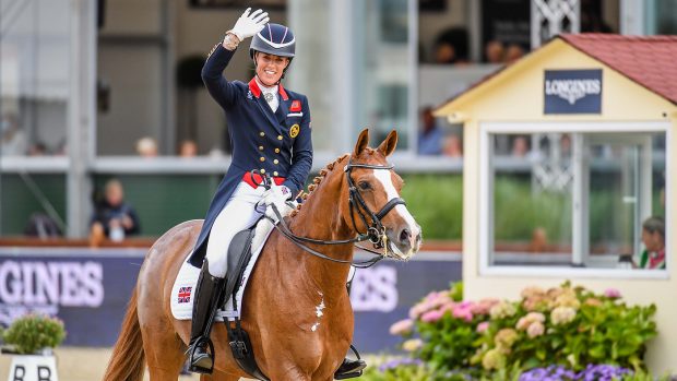 Charlotte Dujardin waves to the crowds after her bronze medal-winning freestyle at the European Dressage Championships